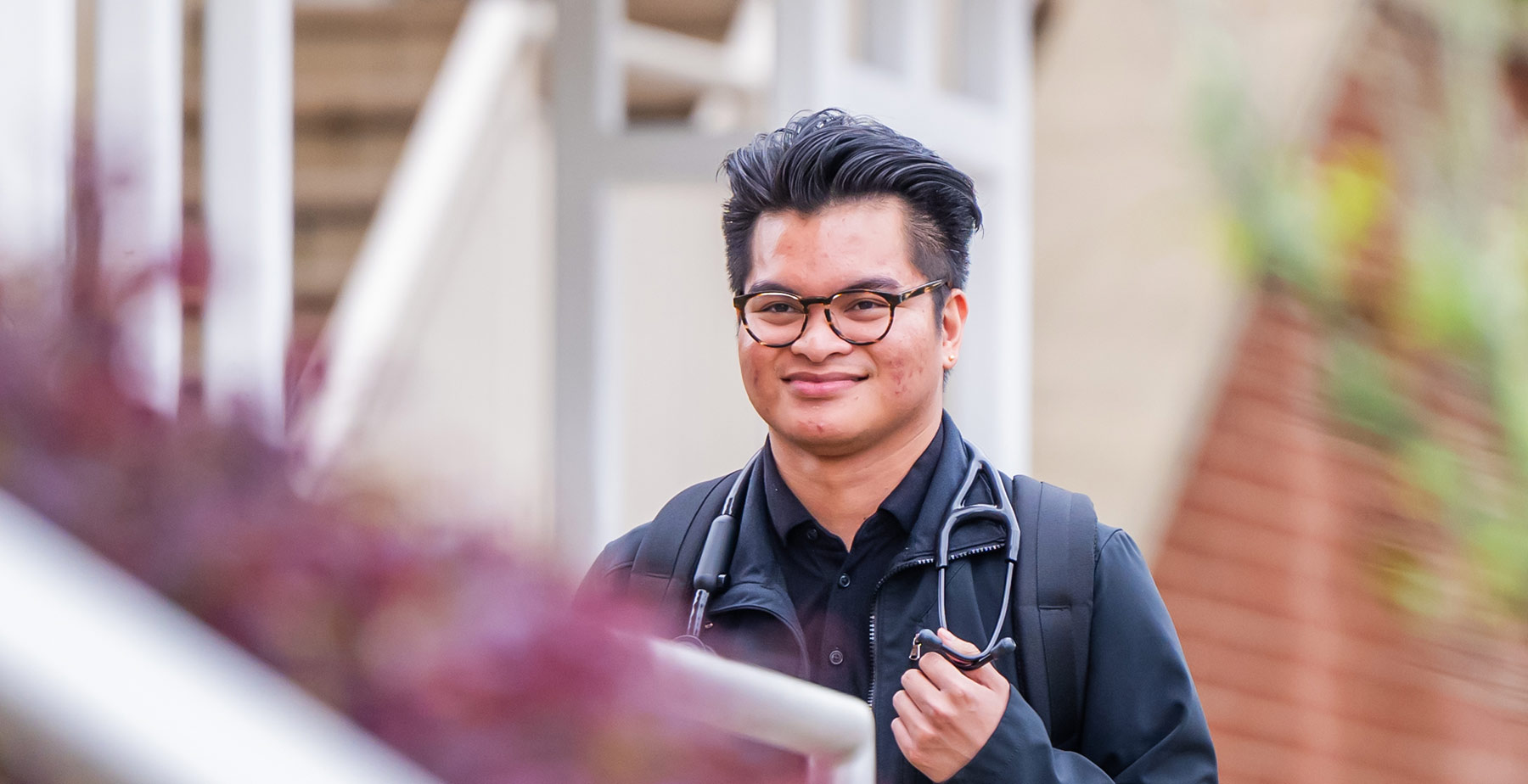 South Alabama Student Walking on Campus