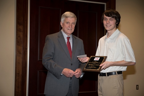 r. Bill Williams presents an Endowment Scholarship to Matthew Starke.