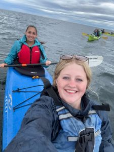 two students in a kayak in Alaskan water