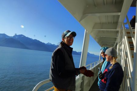 Dr. Amy Sprinkle on a boat with her students