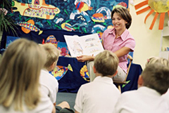 Teacher reading to class.