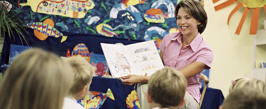 Teacher reading to class.