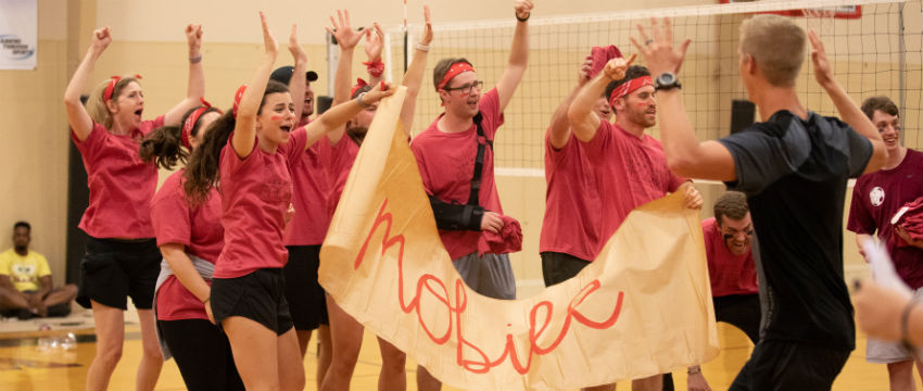 Medical students are assigned to Wellness Houses during a kickball event