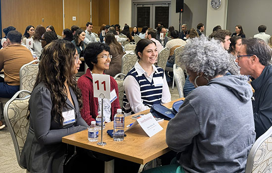 Group speaking at table.