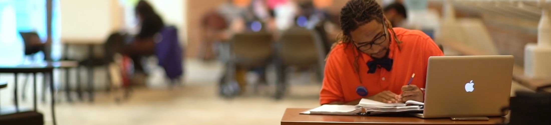 Student studying in academic advising center