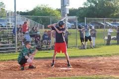 Student getting ready to swing at softball