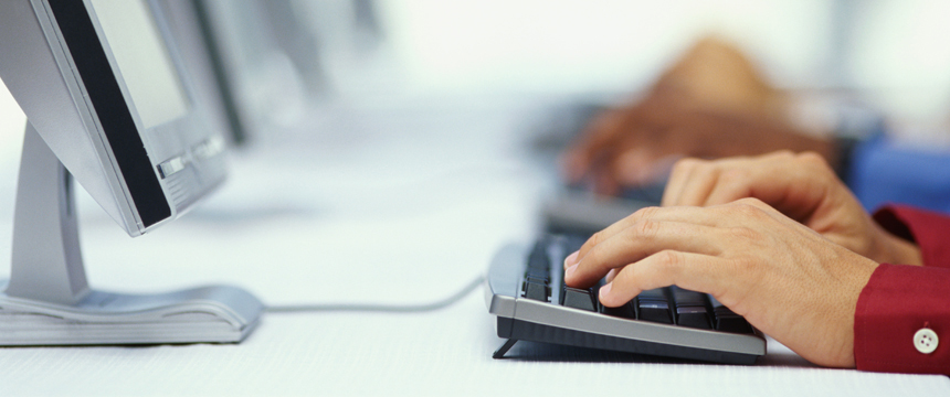 hands on a computer keyboard