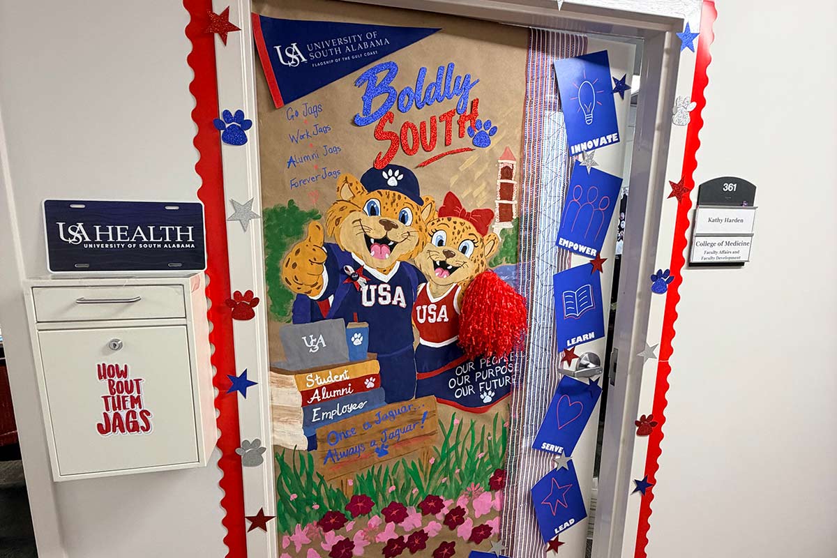 Door decorated for Homecoming with Southpaw and MsPawla and books.